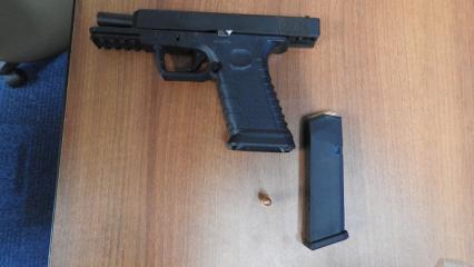 Officer assaulted, handgun and pills seized from accused 